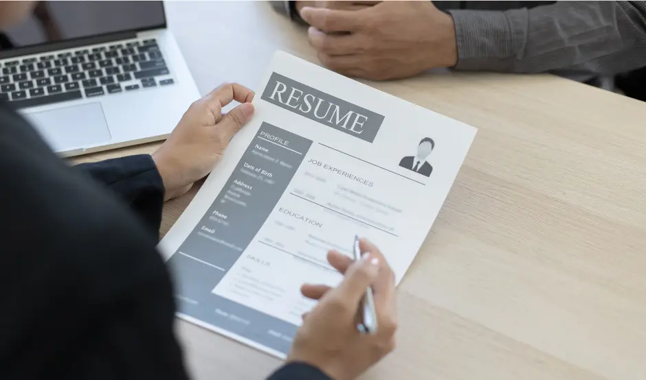 Professional resume writing service with client reviewing resume